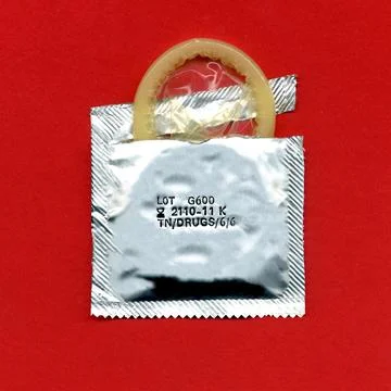 Torn condom pack Stock Photos