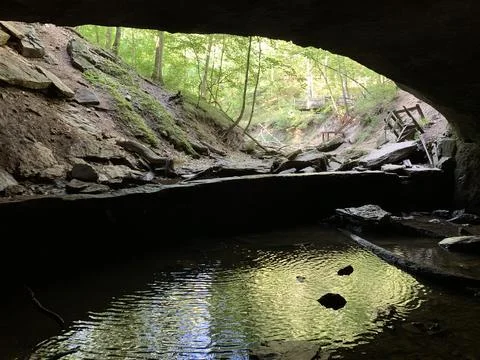 Torn down damn underneath a rock bridge Stock Photos