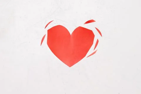 Torn heart on a white background. Cheating, disappointment in love, unrequite Stock Photos