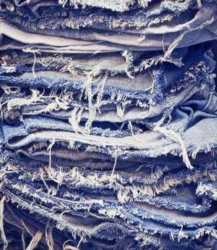 Torn jeans in stack 스톡 사진