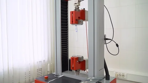 Torn machine tests polyethylene in a laboratory Stock Footage 123438851