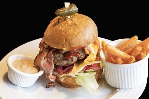 Torn meat in a bun with vegetables and cheese prepared as a hamburger. Ther.. Stock Photos
