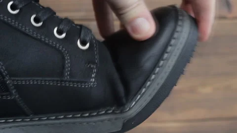 Torn men's shoes, poor-quality shoes, the sole has come off, replacement under Stock Footage 101176361