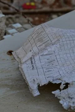 A torn notebook from a kindergarten after the arrival of shells Stock Photos