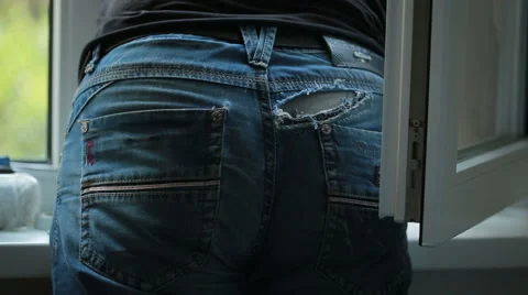 Torn old blue jeans Stock Footage