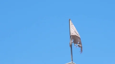 Torn old grey flag Video stock 76450213