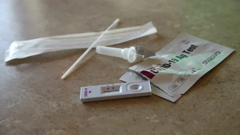 Torn packaging of Covid-19 test on the table Stock Footage 149218034