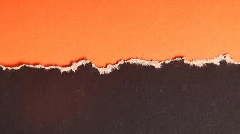 Torn paper background featuring a orange and black textured divided by a ro.. Stock Photos