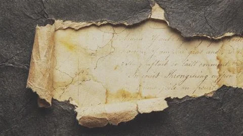 Torn paper on dark background texture. Fotos Stock