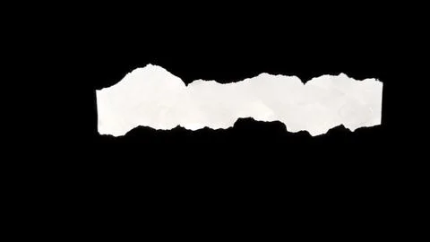 Torn Paper Piece on Black Surface 库存照片