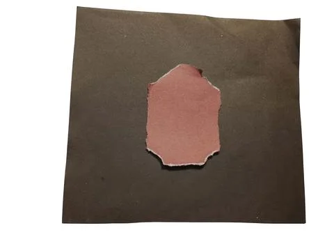 Torn paper piece reddish pink isolated on dark background Stock Illustration