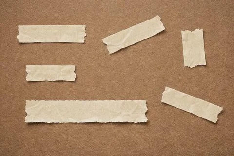 Torn paper strips on brown background. Stock Illustration