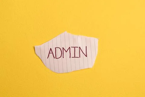 Torn paper written with text ADMIN isolated on yellow background 写真素材