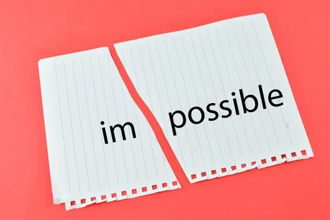 Torn paper written with text IMPOSSIBLE over red background Stock-Fotos
