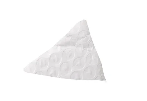 Torn piece of bubble wrap with circular texture and uneven edges Isolated on Stock Photos
