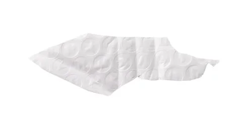 Torn piece of bubble wrap with embossed circular texture, creased folds, and Stock Photos