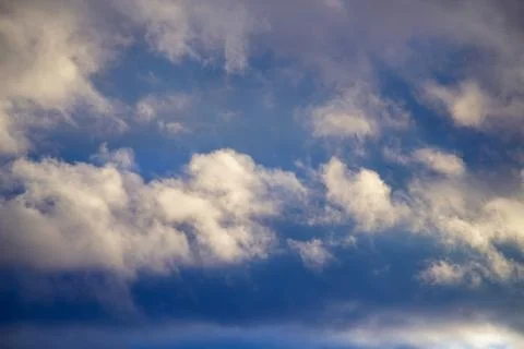 Torn rare clouds in the sky close-up Stock Photos