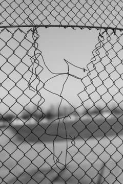 Torn rusty grid Stock Photos