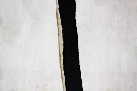 Torn sheet of paper on a black background. Texture design elements with space Stock Photos