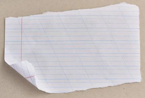 A torn sheet of a school notebook with a slanted line and a folded corner, .. Stock Photos