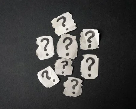 Torn square papers with question mark symbol Stock Photos