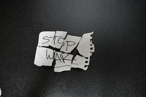 Torn Stop War Message Symbol of Conflict and Destruction Stock Photos