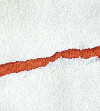 Torn textured red and white paper background Foto stock