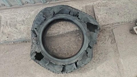 Torn tire. The result of a tire explosion Stock Footage 273593617