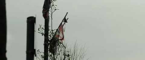 Torn Union Jack Fluttering Gently in the Wind - Wide Stock Footage 140261027
