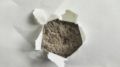 Torn White Paper Hole with Rough Gray Concrete Texture Background Stock Photos