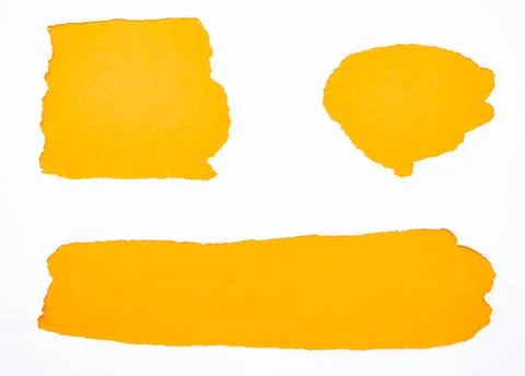 Torn white paper isolated on orange Torn white paper isolated on orange Co... Stock Photos