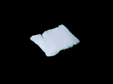 Torn White Paper Piece on Solid Black Background with Rough Edges Stock Photos