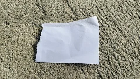 Torn White Paper Strip on Rough Gray Concrete Texture Background Stock Photos