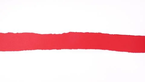 Torn white sheet of paper with rough edges revealing red background with copy Foto stock