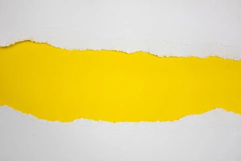 Torn white stripes on a yellow background. Copy space. Stock Photos