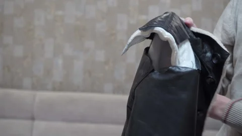 Torn winter jacket Stock Footage 318906879