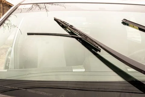 A torn wiper blade will scratch the car glass Stock Photos