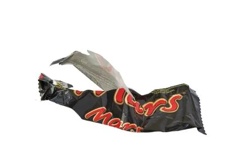 Torn wrapper of a big Mars candy bar. Stock Photos