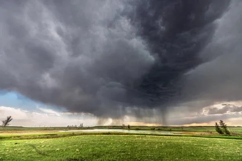 Tornadic Cell over Grassy Field Stock Photos
