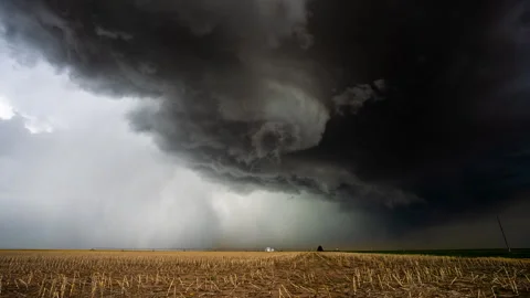 Tornadic storm clouds spin over head in dramatic scene Video stock 285935585