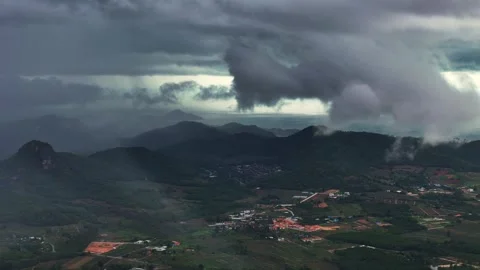 Tornadic storm column forms over coastal mountains during severe monsoon cloud 스톡 동영상 314762119