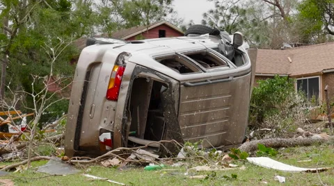 Tornado aftermath - vehicle flipped over Stock Footage 60749434