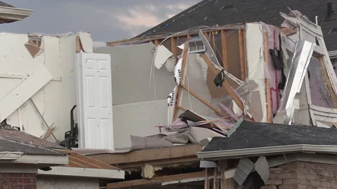 Tornado and severe thunderstorm damage to homes in residential area Stock Footage 157616551