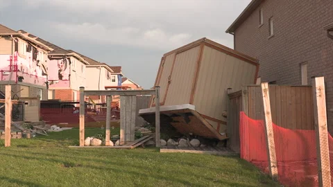 Tornado and severe thunderstorm damage to homes in residential area Stock Footage 157619416