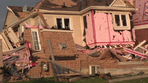 Tornado and severe thunderstorm damage to homes in residential area Stock Footage 157619642