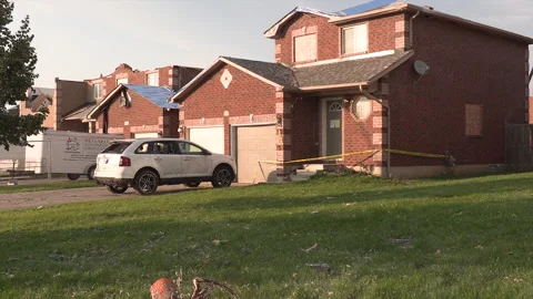 Tornado and severe thunderstorm damage to homes in residential area Stock Footage 157620429