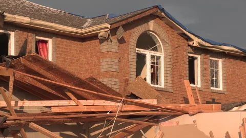 Tornado and severe thunderstorm damage to homes in residential area Stock Footage 157621106