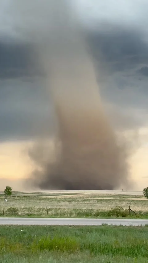 Tornado in a field during a severe weather event in Colorado Stock Footage 329638977
