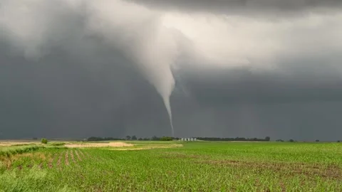 Tornado forming over a farm field Stock Footage 329701740