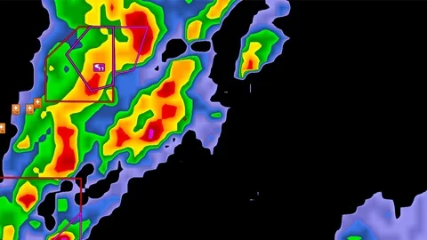 Tornado warning on severe thunderstorms crossing weather radar screen Stock Footage